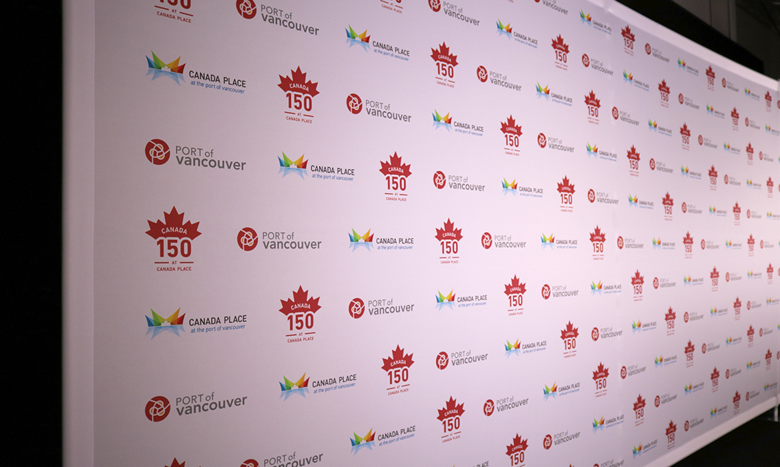 A Quick Wall commemorating Canada's 150th birthday, with logos for Canada's 150th, Port of Vancouver, and Canada Place in an alternating step-and-repeat pattern.