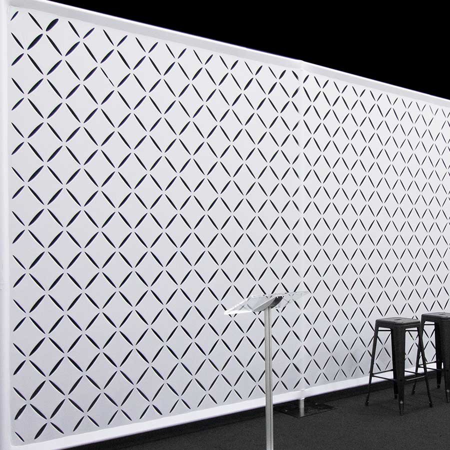 Stretch Fabric Wall With Geometric Patterns Cut Into It