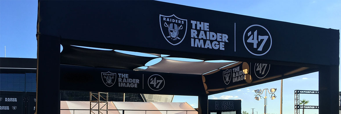 a black printed truss banner supporting the las vegas raiders