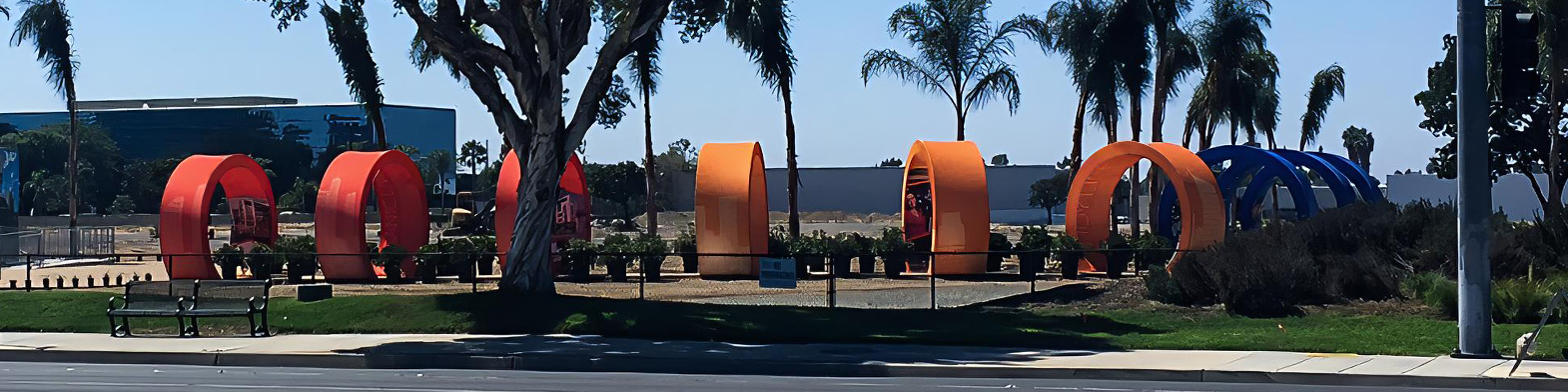 Metal Tube Frame Arches Covered In Orange High Performance Stretch Fabric